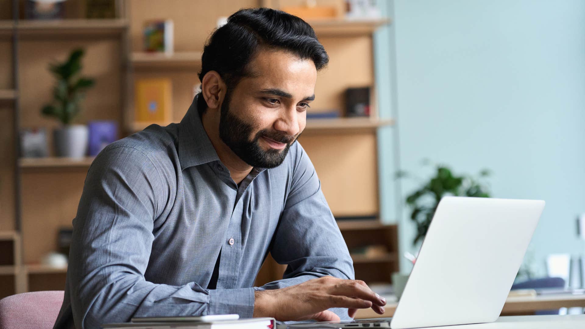 young man working on laptop