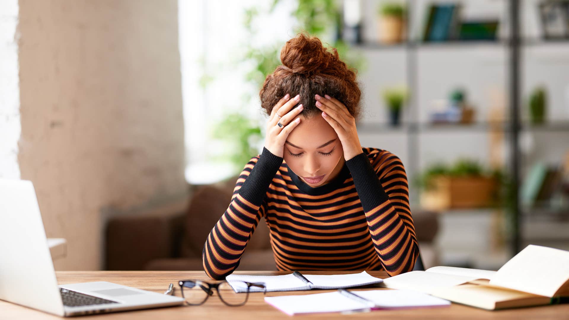 young woman stressed while working