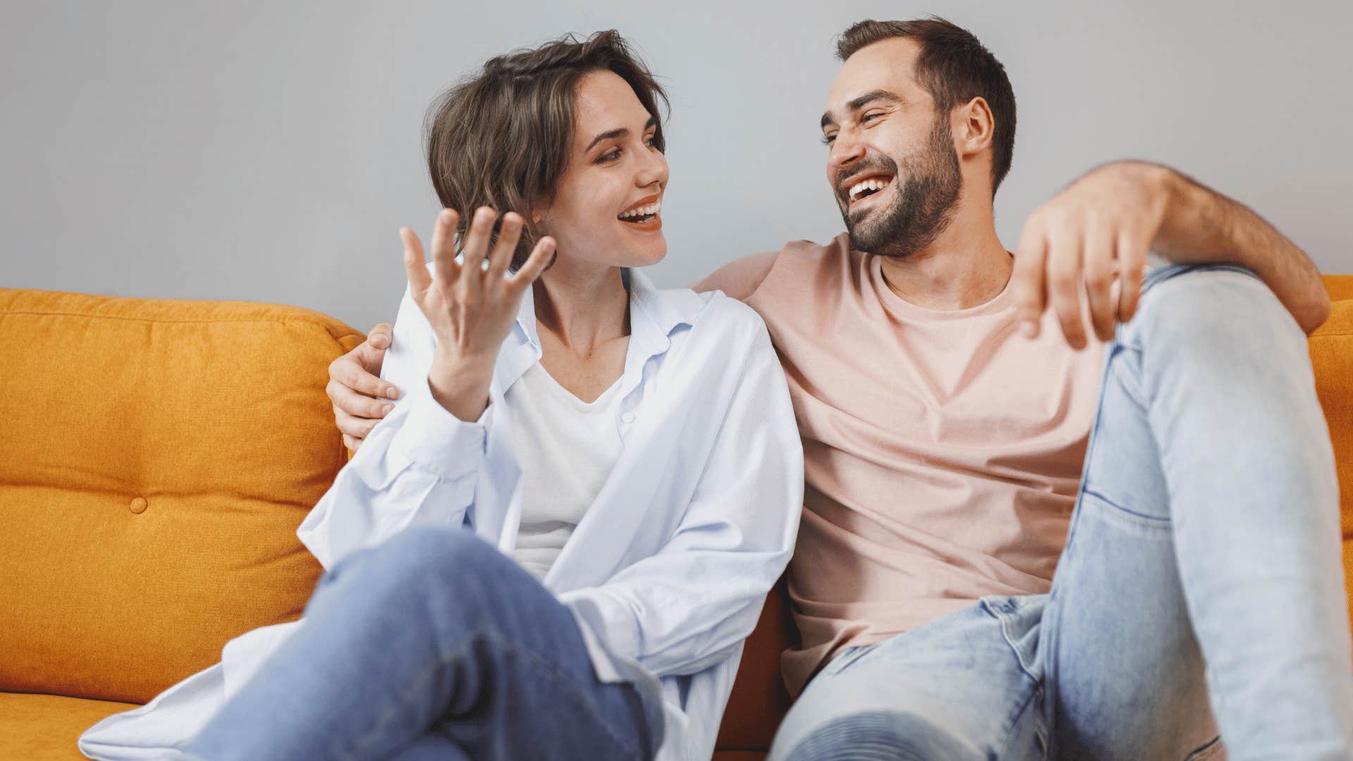 couple sitting on couch talking about what they need