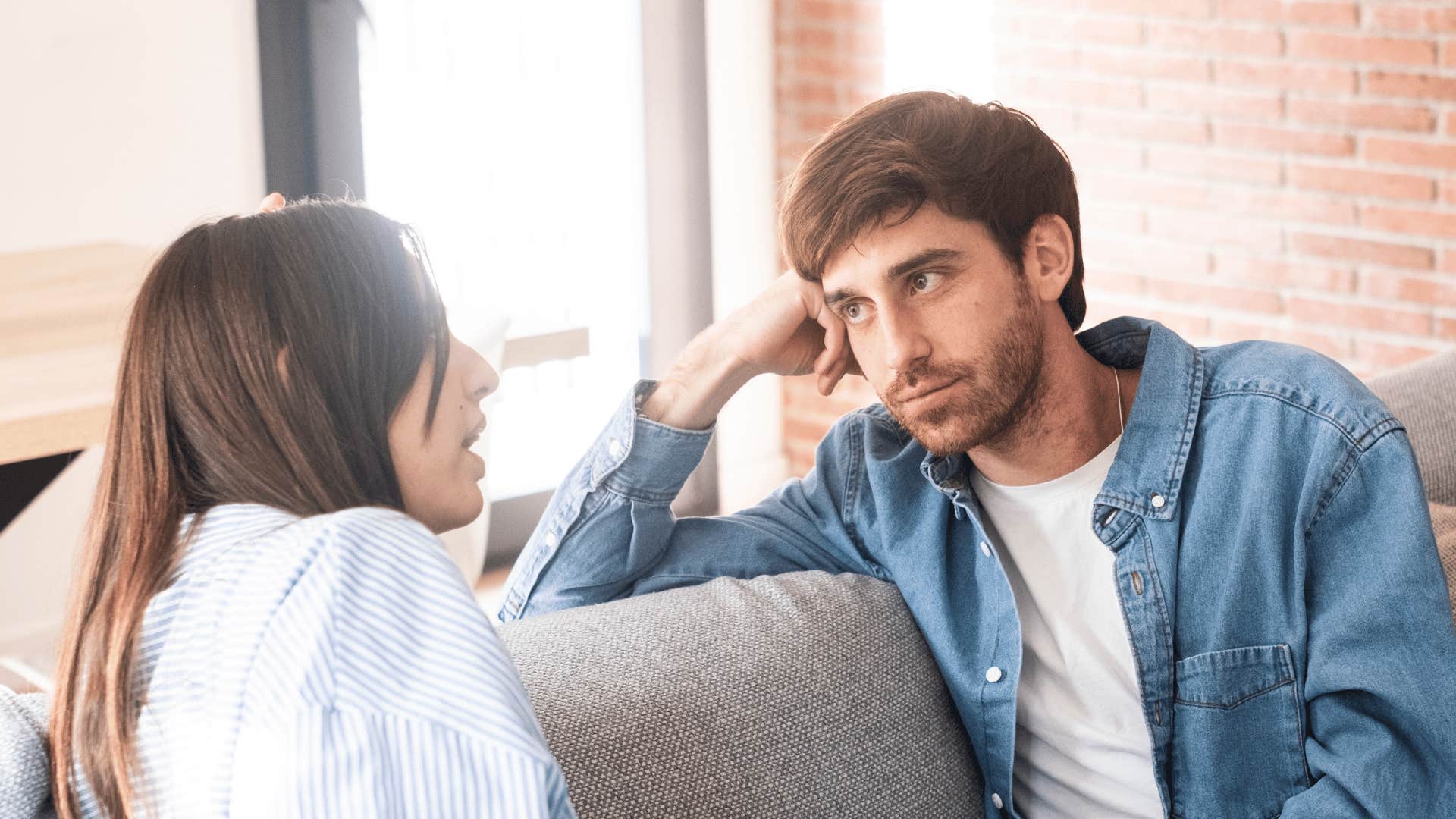 man ruining a good first impression by talking too closely to woman