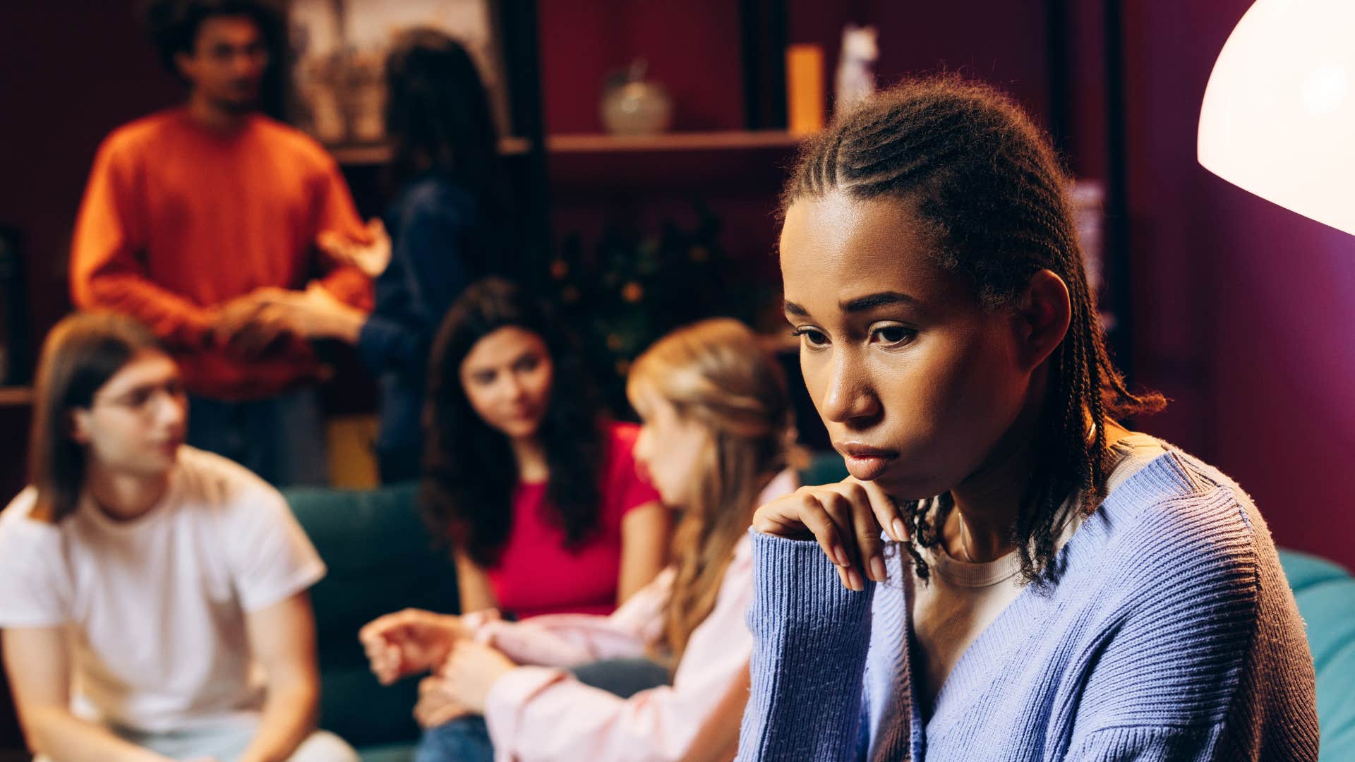 introverted woman feeling socially drained in group