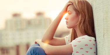 The Real Reason Women Turn A Blind Eye When Their Men Cheat woman touching hand to forehead