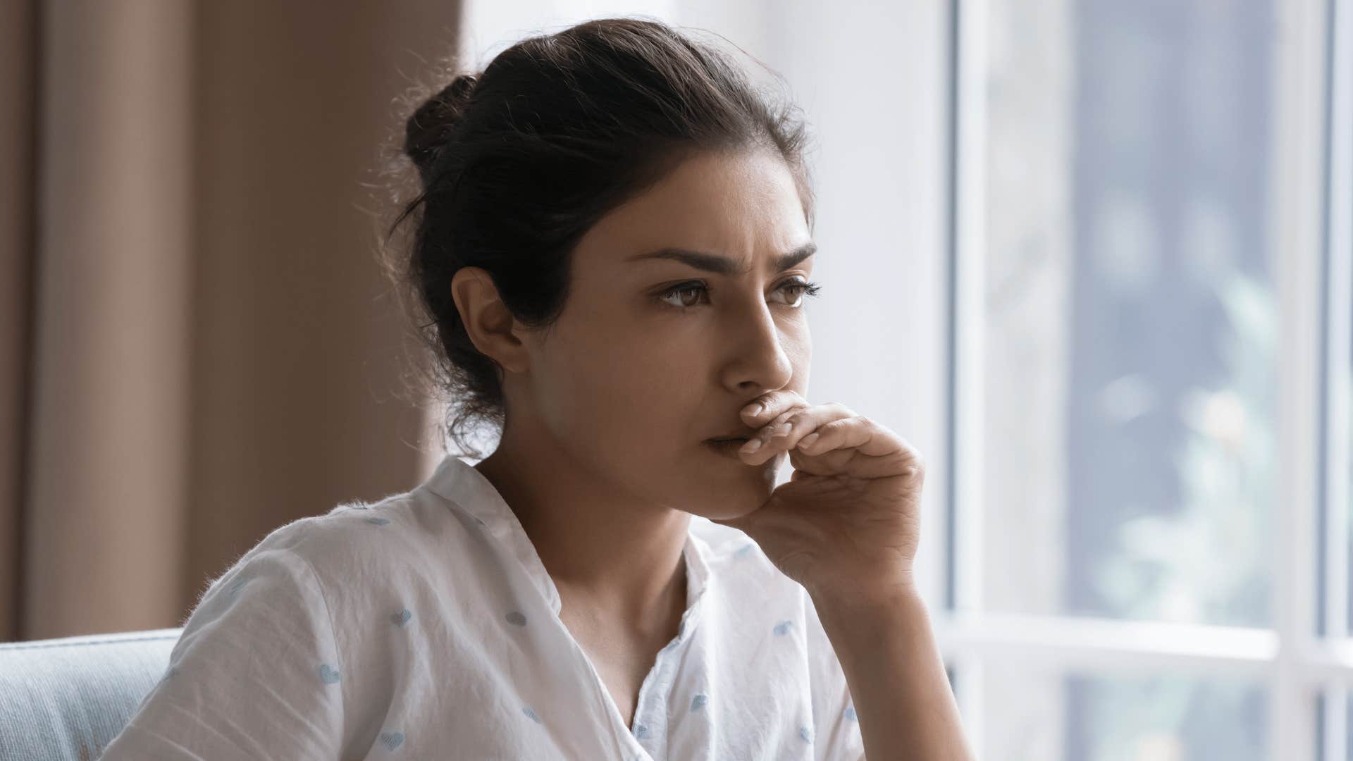 sad woman with unspoken resentment towards her husband