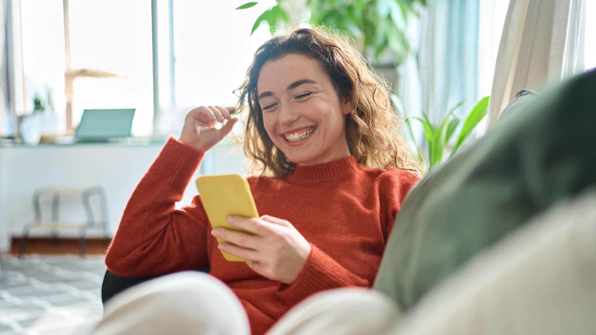 woman who is naturally calm as she finds something that makes her smile