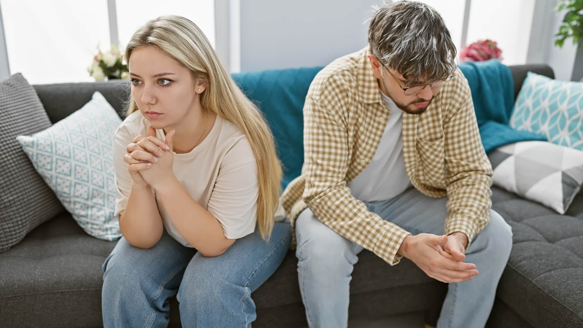Adult child of divorce looks away from a man who loves her 