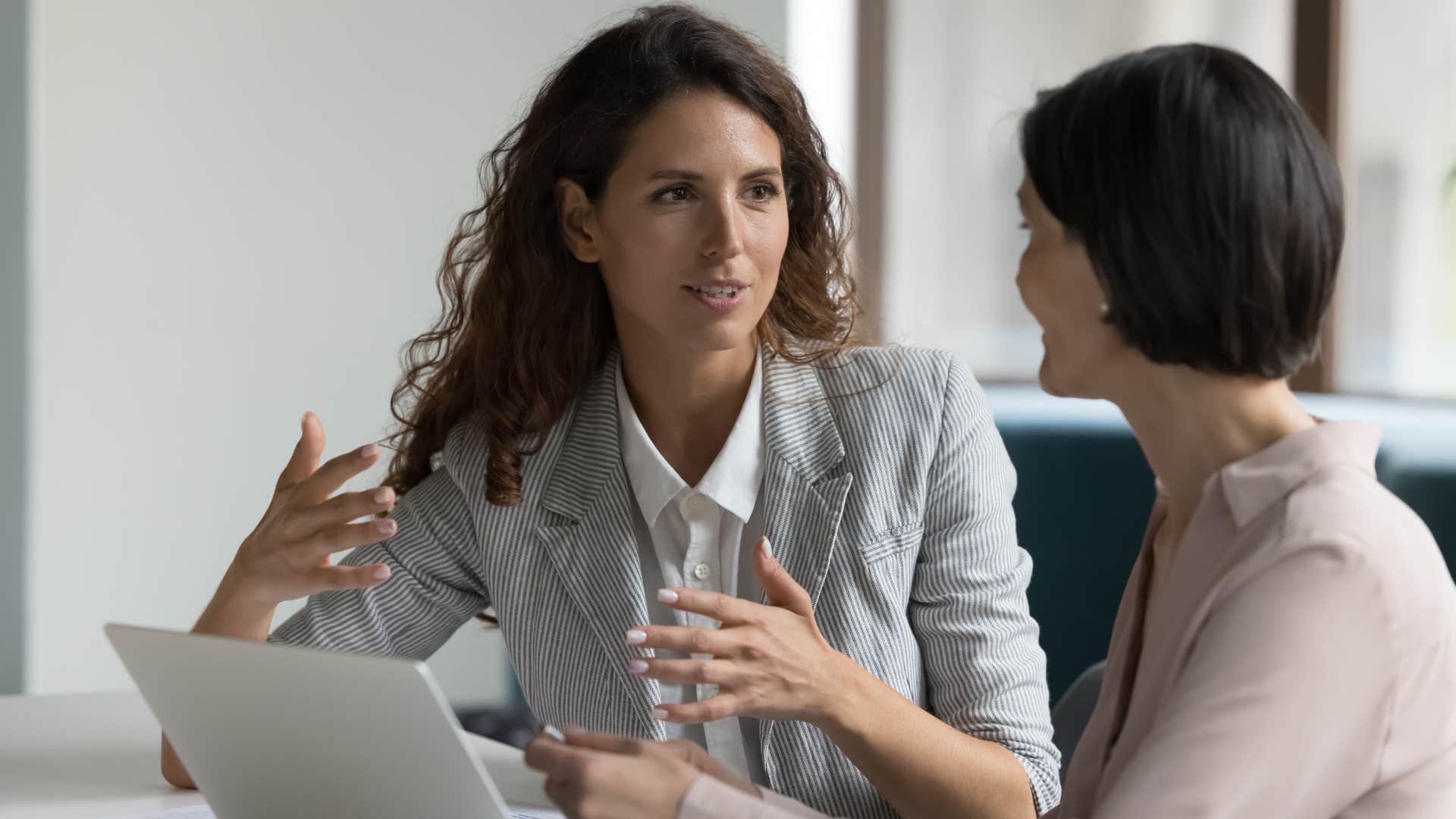 woman setting boundaries with her boss at work