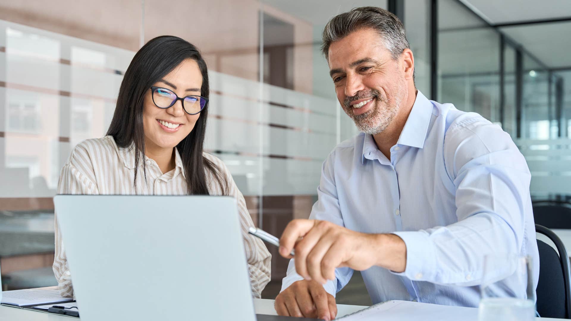 man expressing gratitude to colleague in a work meeting