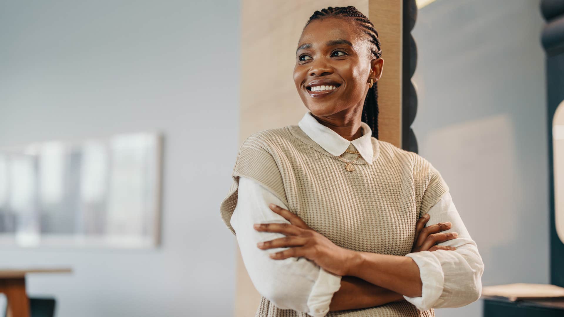 businesswoman reflecting on her personal values smiling