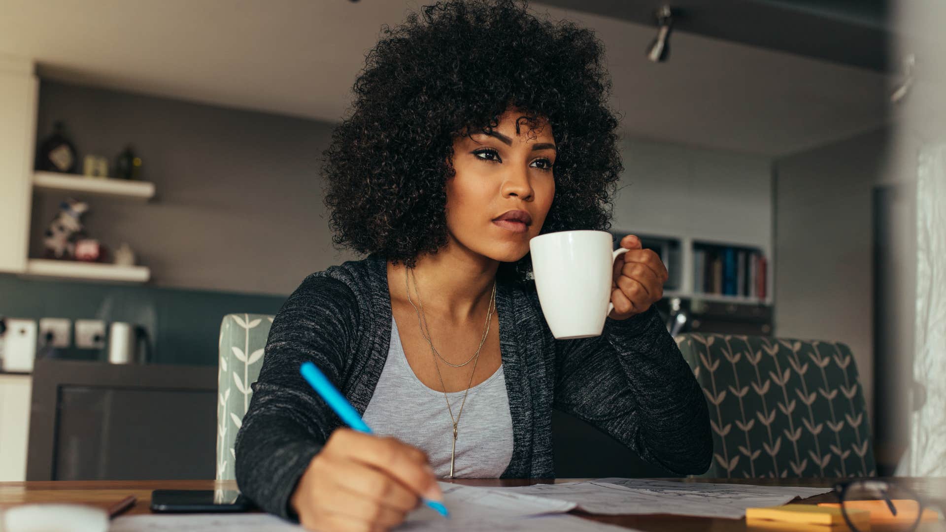 woman with a fulfilling routine drinking coffee and working