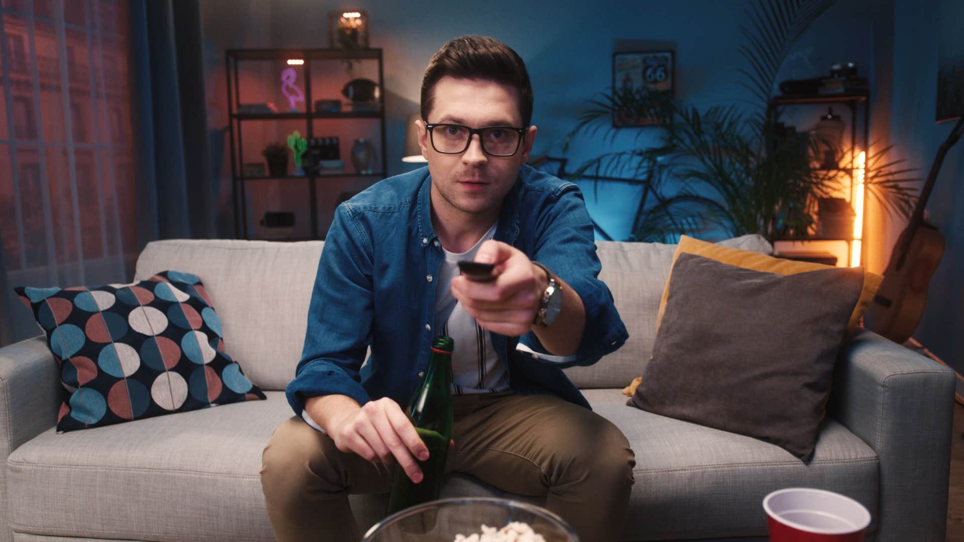 man watching his streaming services on tv
