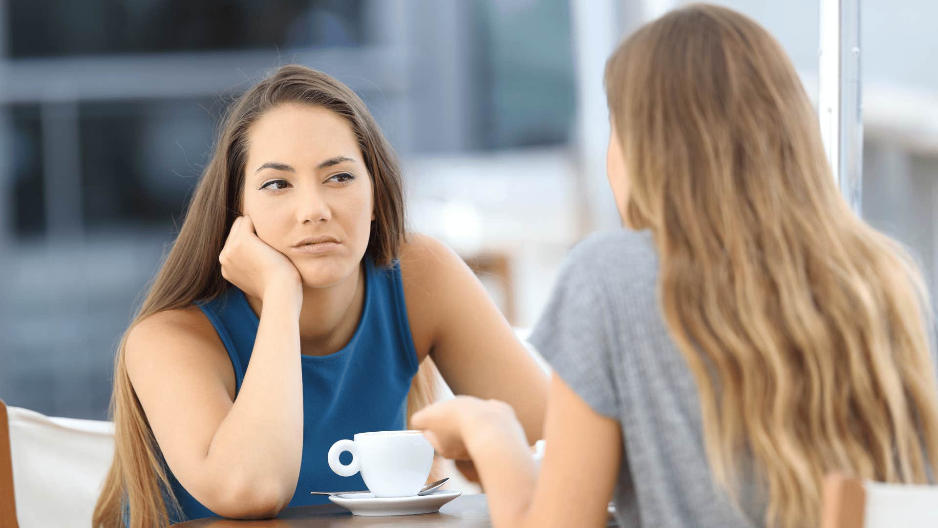 women having coffee together talking about money