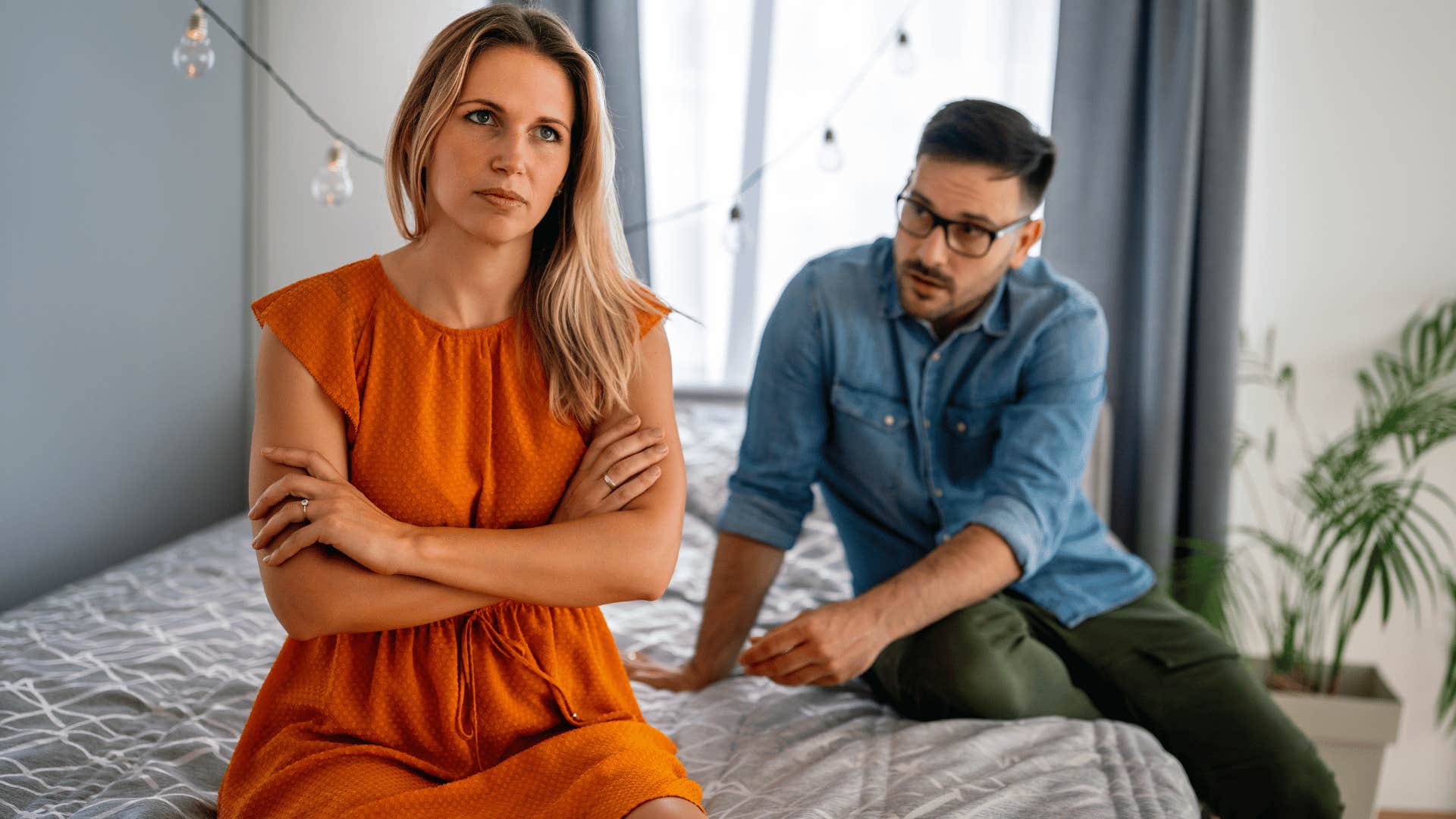 Man talking to a woman he probably shouldn't marry while she ignores him