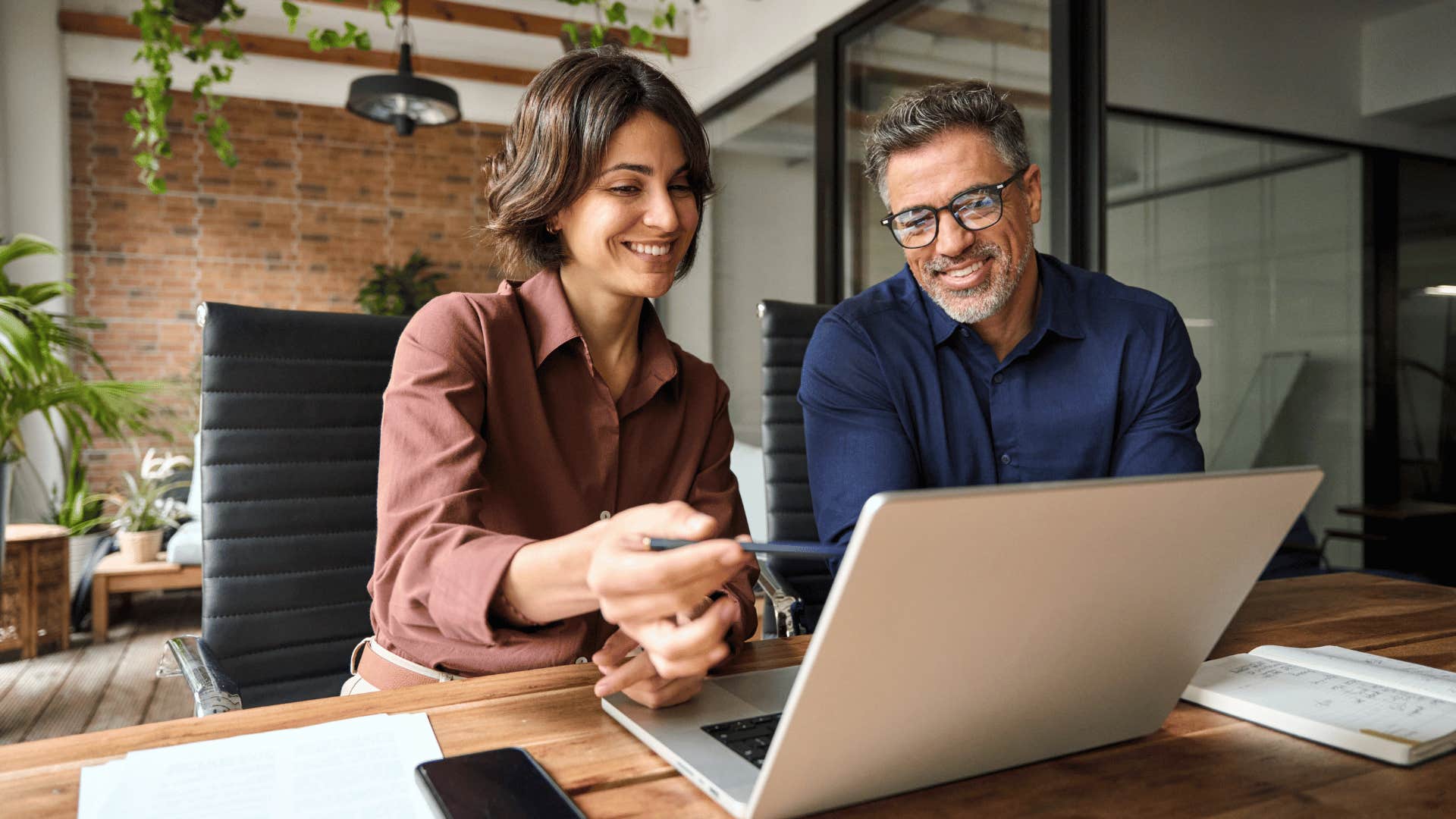 Woman who grew up with lots of money working hard alongside a male colleague 
