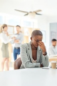 Exhausted woman looking drained and overwhelmed, symbolizing burnout and survival mode before discovering self-love and nervous system healing