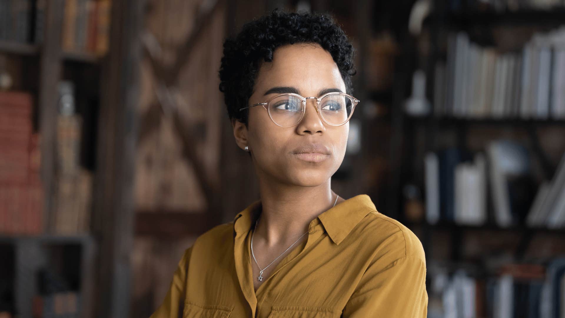 Woman whose parents did an exceptional job calmly manages stress in a library
